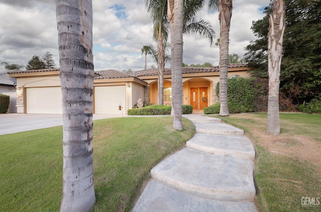 4400 Cron Way, Bakersfield, CA 93311 - mediterranean / spanish house with driveway, an attached garage, stucco siding, and a front lawn
