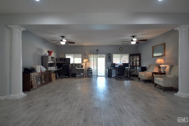 living room featuring ceiling fan and hardwood / wood-style flooring