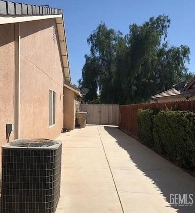 11712 Novara Ave, Bakersfield, CA 93312 - view of patio / terrace with central air condition unit and a fenced backyard
