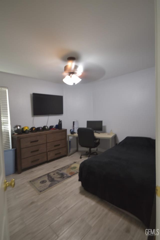 bedroom featuring ceiling fan and light hardwood / wood-style floors