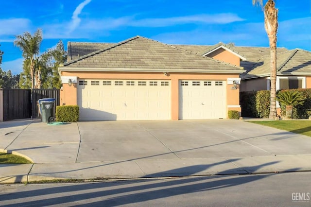 11712 Novara Ave, Bakersfield, CA 93312 - single story home with an attached garage, driveway, a tiled roof, stucco siding, and fence