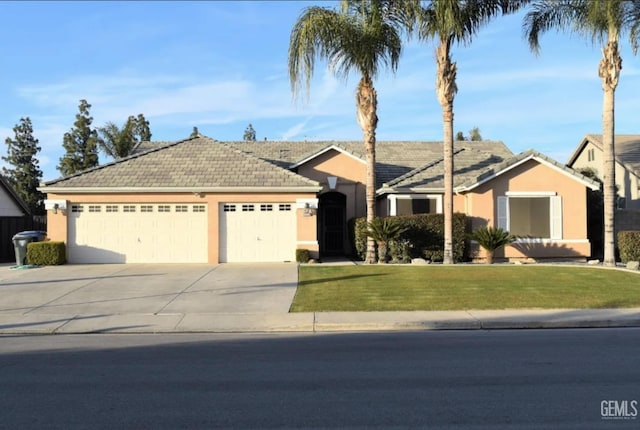 single story home with a garage and a front lawn