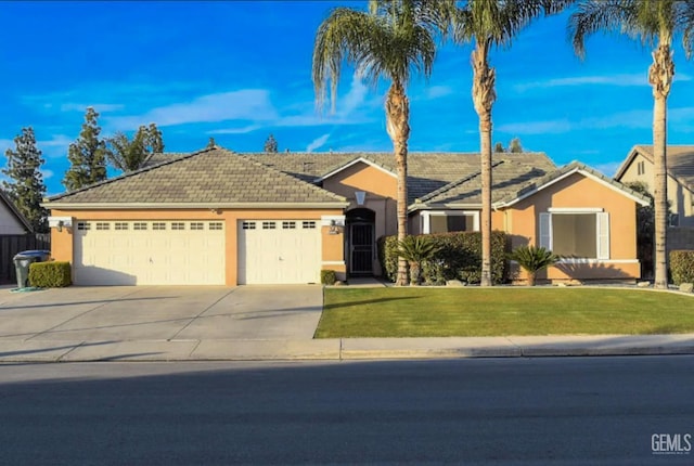 11712 Novara Ave, Bakersfield, CA 93312 - ranch-style house featuring an attached garage, driveway, stucco siding, a front lawn, and a tile roof