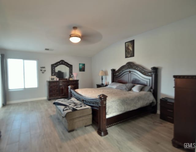 bedroom with ceiling fan and light hardwood / wood-style flooring