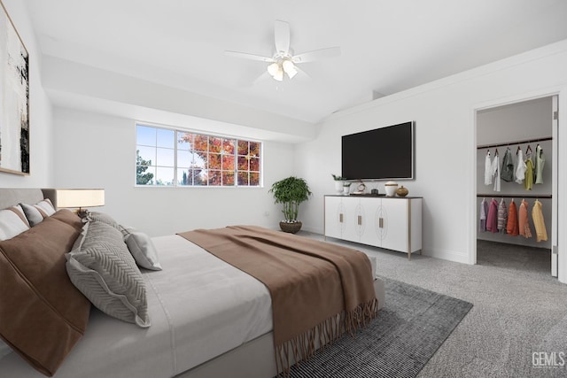 bedroom with ceiling fan, carpet flooring, and vaulted ceiling