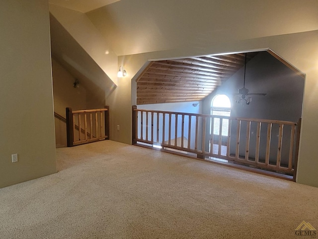 additional living space featuring carpet, vaulted ceiling, and ceiling fan