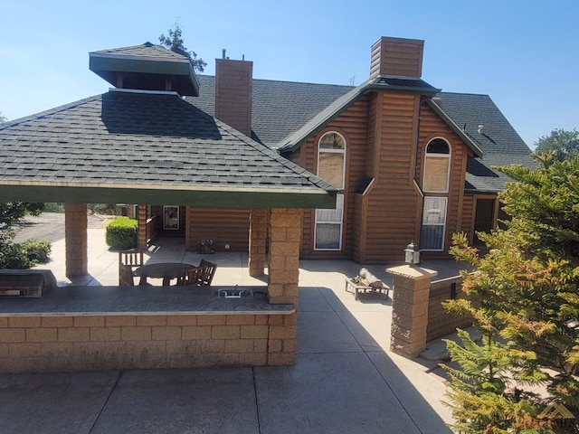 view of community with a patio