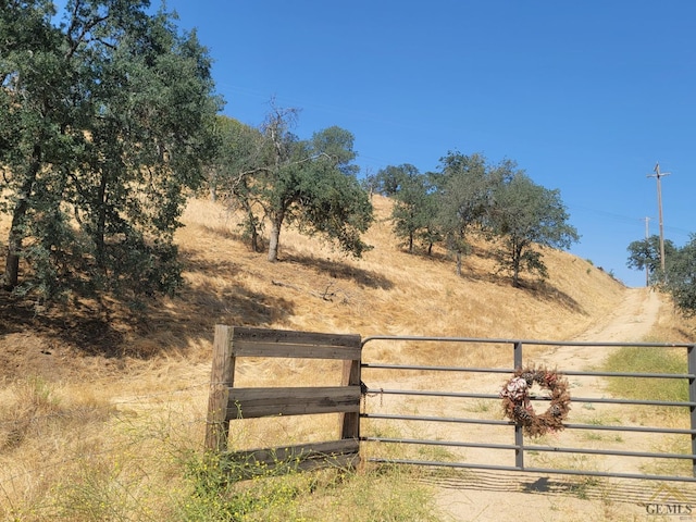 view of gate featuring a rural view