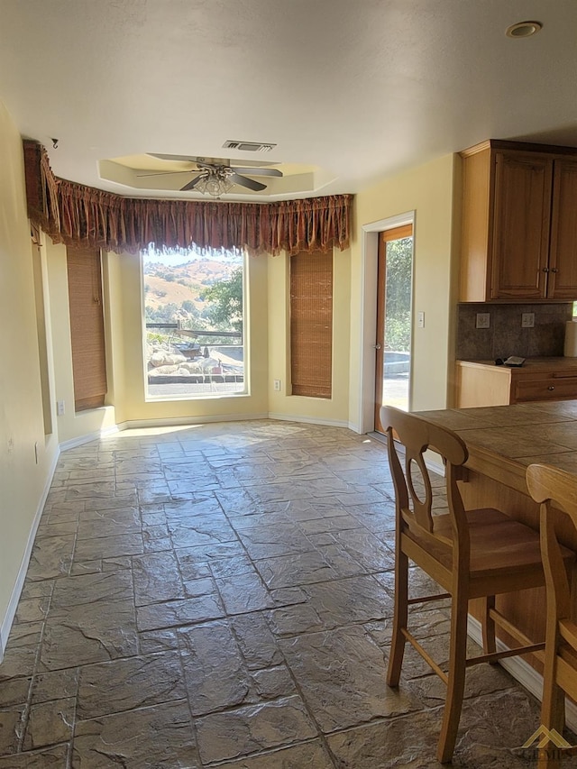 dining space with ceiling fan