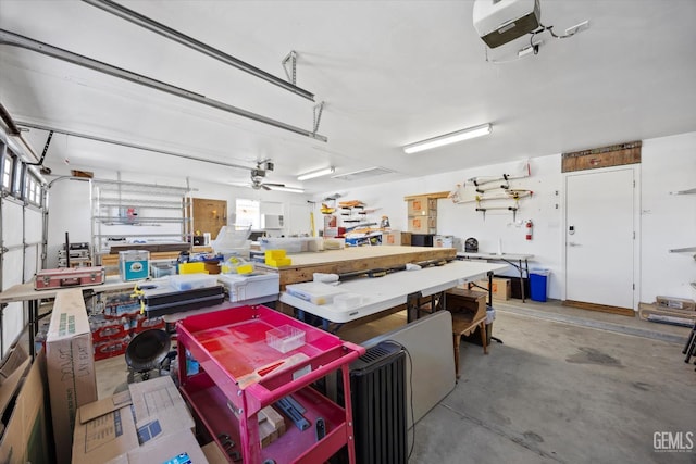 4504 Polo Club Dr, Bakersfield, CA 93312 - garage with a workshop area and a garage door opener