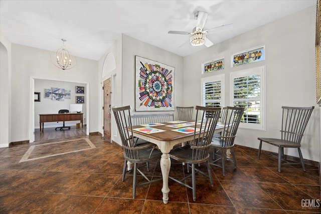 4504 Polo Club Dr, Bakersfield, CA 93312 - dining space with a ceiling fan, a chandelier, a desk, and arched walkways