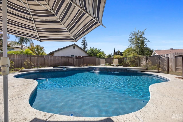 4504 Polo Club Dr, Bakersfield, CA 93312 - view of swimming pool with a fenced backyard, a pool with connected hot tub, and a patio