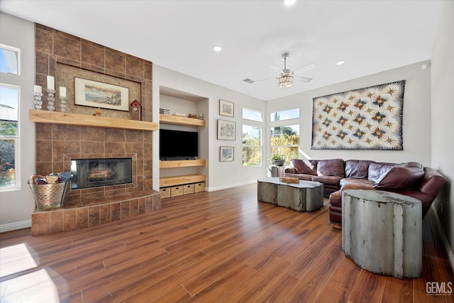 4504 Polo Club Dr, Bakersfield, CA 93312 - living room featuring wood finished floors, built in shelves, a ceiling fan, plenty of natural light, and recessed lighting
