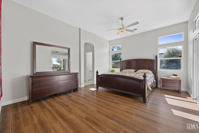 4504 Polo Club Dr, Bakersfield, CA 93312 - bedroom featuring arched walkways, wood finished floors, and a ceiling fan
