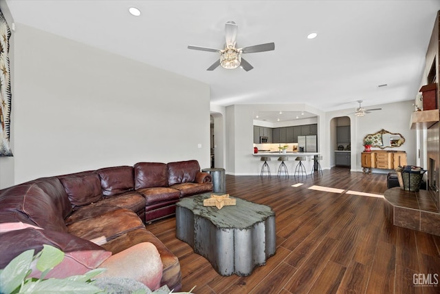 4504 Polo Club Dr, Bakersfield, CA 93312 - living area featuring a ceiling fan, arched walkways, recessed lighting, and wood finished floors
