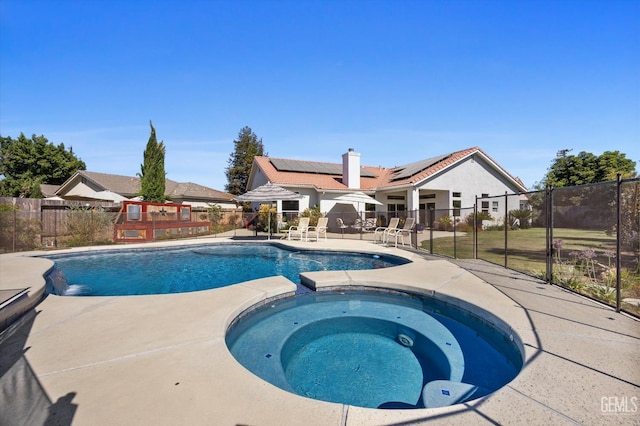 4504 Polo Club Dr, Bakersfield, CA 93312 - view of pool featuring a patio, a pool with connected hot tub, and a fenced backyard