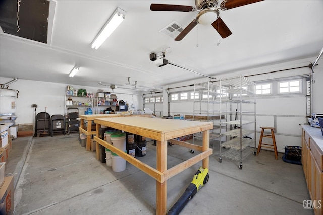 4504 Polo Club Dr, Bakersfield, CA 93312 - garage featuring a workshop area, a ceiling fan, and a garage door opener