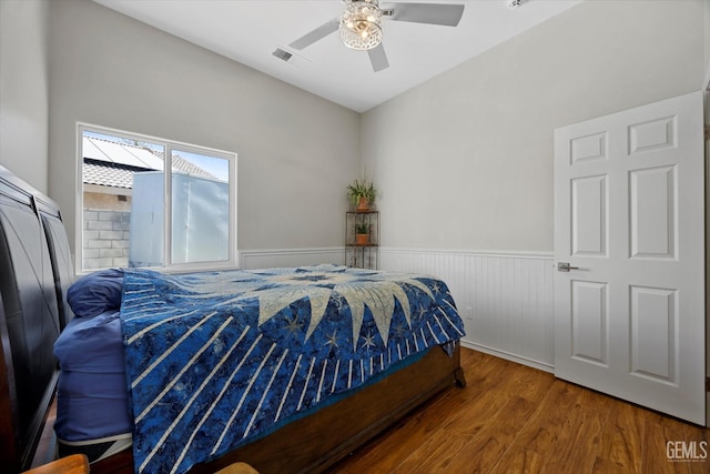 4504 Polo Club Dr, Bakersfield, CA 93312 - bedroom featuring wood finished floors, wainscoting, and a ceiling fan