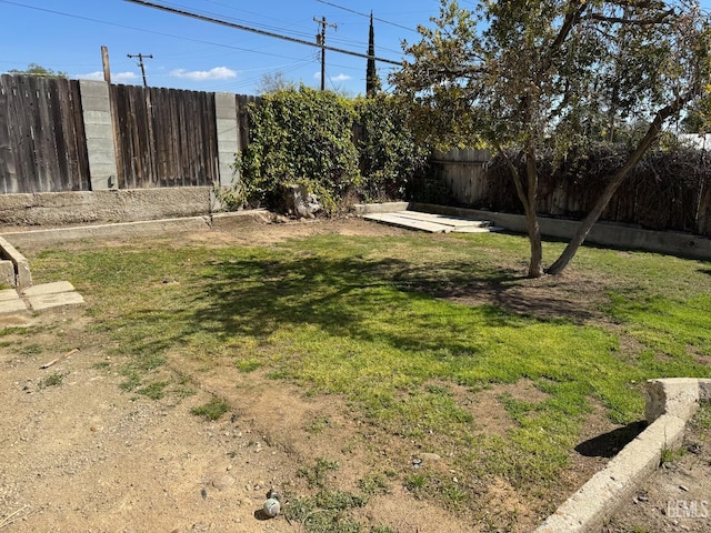 view of yard with a fenced backyard