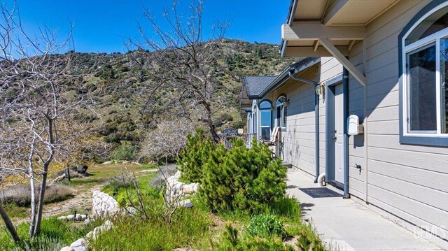 view of home's exterior featuring a mountain view