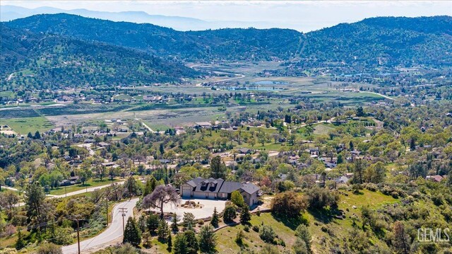 drone / aerial view featuring a mountain view