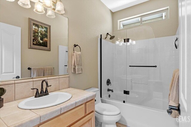 full bath with backsplash, toilet, tub / shower combination, and vanity