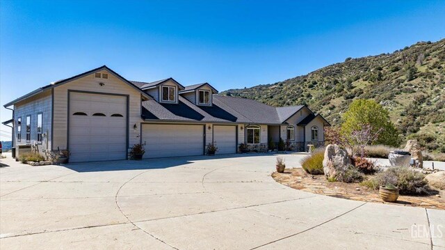 view of front of home with a garage and concrete driveway