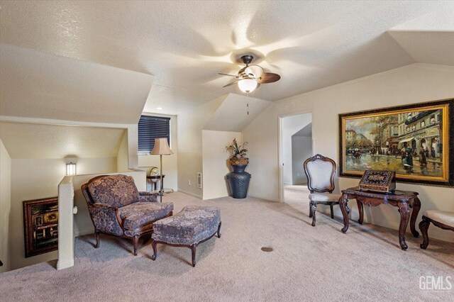 living area with carpet floors, a ceiling fan, a textured ceiling, and lofted ceiling