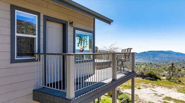 wooden terrace with a mountain view