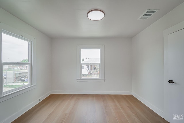 710 Fillmore St, Taft, CA 93268 - unfurnished room with baseboards, a wealth of natural light, light wood-style flooring, and visible vents