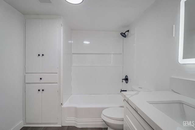 710 Fillmore St, Taft, CA 93268 - bathroom featuring toilet,  shower combination, wood finished floors, visible vents, and vanity