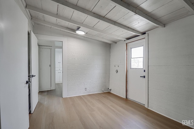 710 Fillmore St, Taft, CA 93268 - unfurnished room with beamed ceiling, light wood finished floors, and wooden ceiling