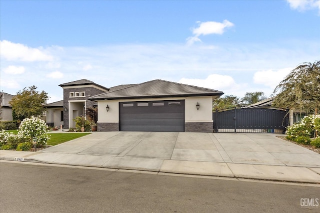 prairie-style home featuring a garage