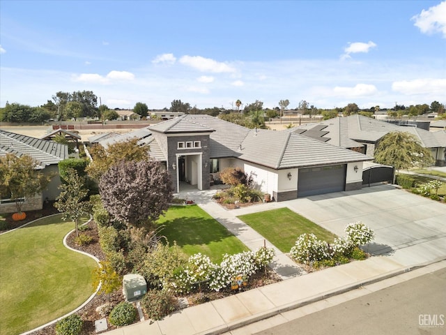 view of front of home with a garage and a front yard