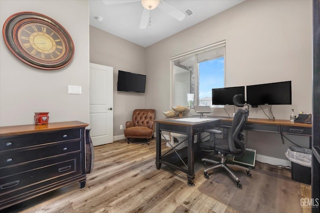 office featuring light hardwood / wood-style floors and ceiling fan