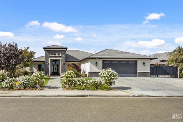 prairie-style home featuring a garage