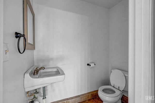 bathroom with sink and toilet