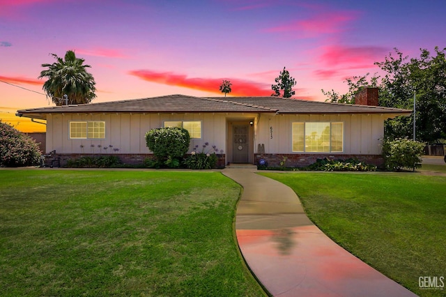 6513 Desmond Ct, Bakersfield, CA 93308 - ranch-style house with a chimney, a yard, and board and batten siding