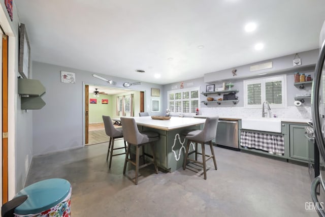 6513 Desmond Ct, Bakersfield, CA 93308 - dining space with concrete flooring, recessed lighting, and a community bar