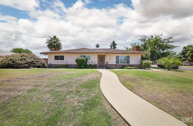 6513 Desmond Ct, Bakersfield, CA 93308 - ranch-style house featuring a chimney, a front lawn, and board and batten siding