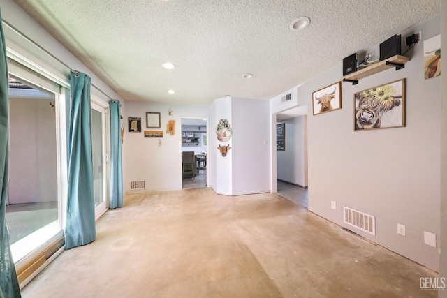 6513 Desmond Ct, Bakersfield, CA 93308 - unfurnished room with a textured ceiling, recessed lighting, and concrete floors