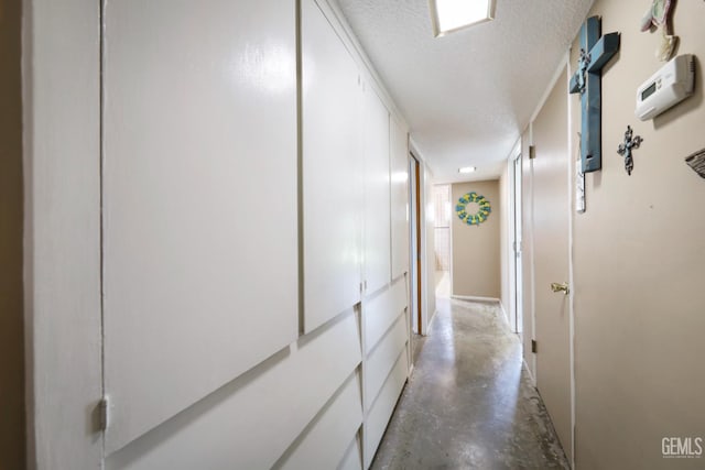 6513 Desmond Ct, Bakersfield, CA 93308 - corridor featuring concrete floors and a textured ceiling