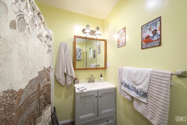 6513 Desmond Ct, Bakersfield, CA 93308 - bathroom with vanity and vaulted ceiling