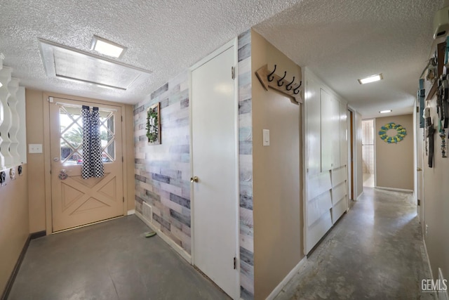 6513 Desmond Ct, Bakersfield, CA 93308 - hallway with finished concrete floors and a textured ceiling