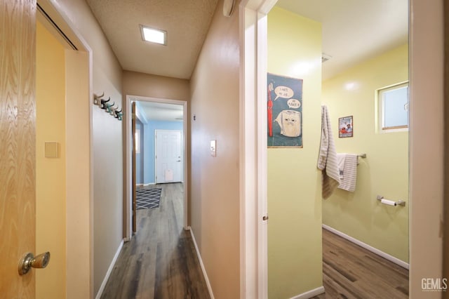 6513 Desmond Ct, Bakersfield, CA 93308 - hallway featuring dark wood-style floors and baseboards
