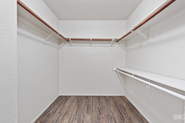 1085 Mast Ave, Mc Farland, CA 93250 - spacious closet featuring dark wood-type flooring