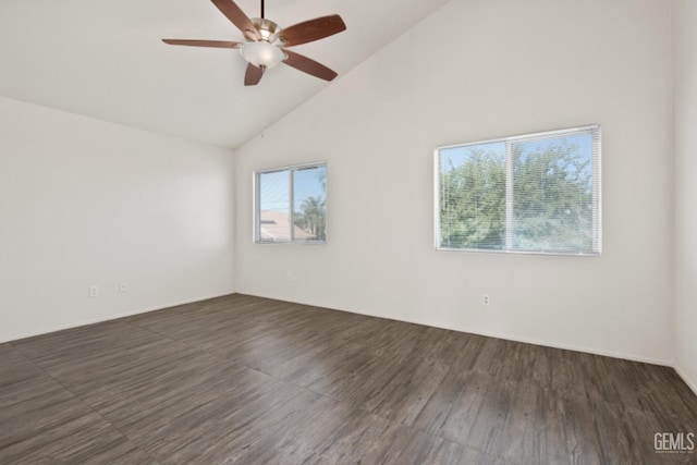 spare room featuring dark hardwood / wood-style floors, high vaulted ceiling, and ceiling fan