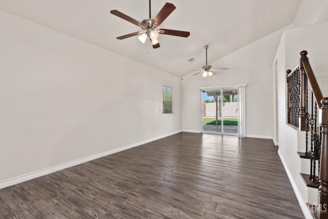 spare room with ceiling fan, dark hardwood / wood-style flooring, and vaulted ceiling