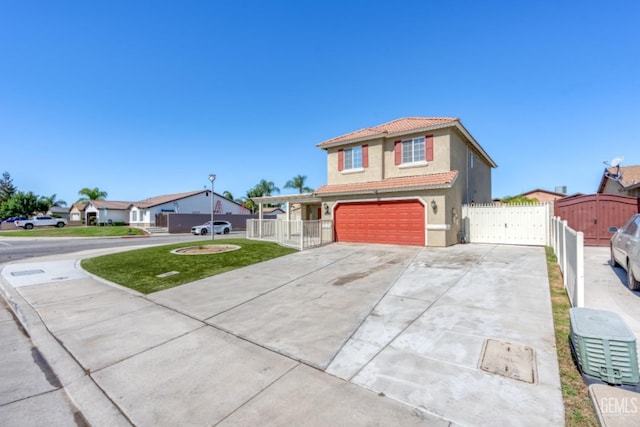 view of front of home with a front lawn and a garage