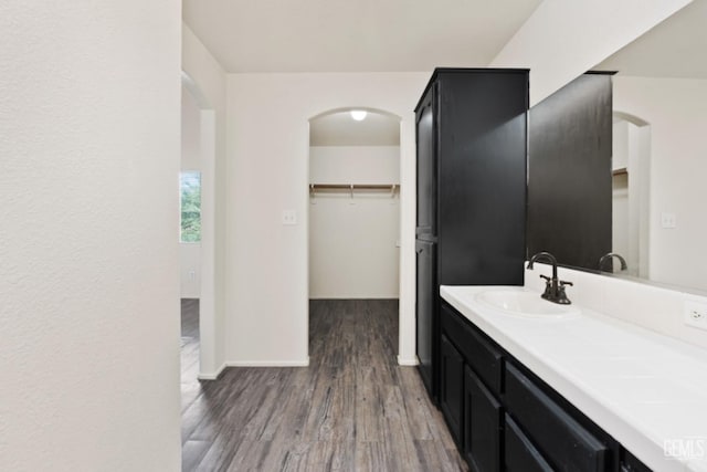 bathroom featuring vanity and wood-type flooring